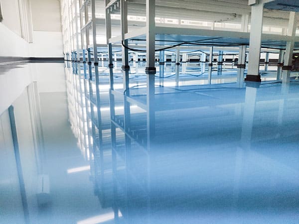 a cable under rack legs at sea blue epoxy floor. (Industrial epo
